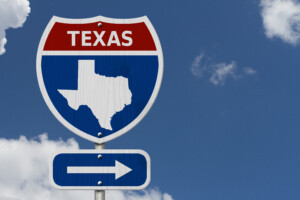 Texas Road sign with an arrow.