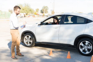 Group of drivers attending a defensive driving course in a classroom, learning safe driving techniques.